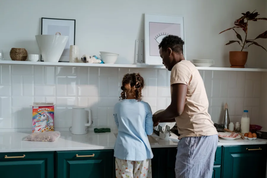 Family together in a bright kitchen at home