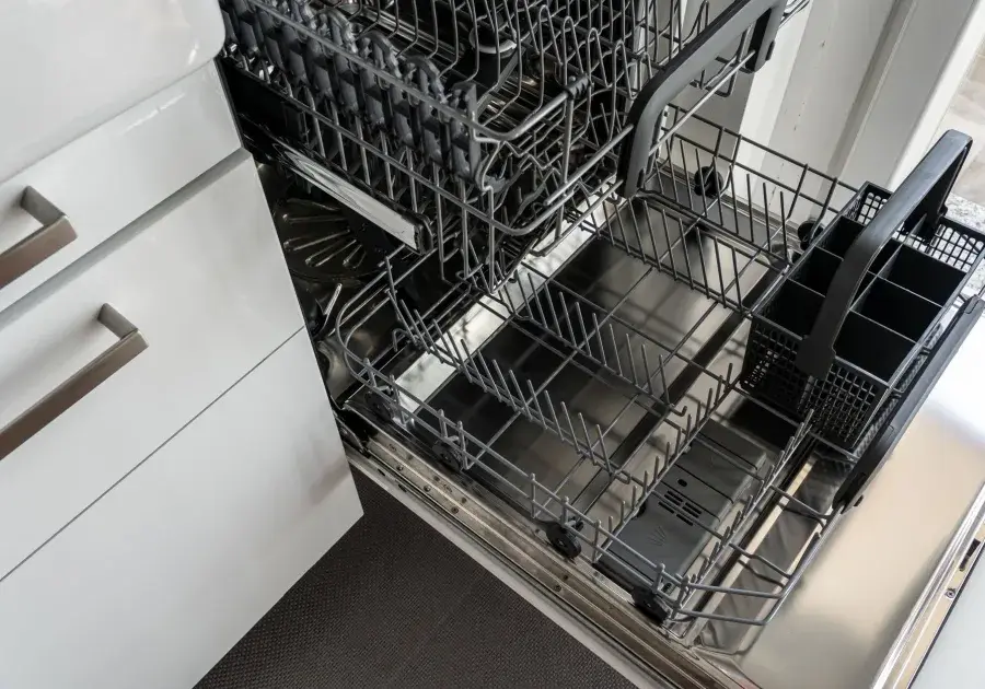 Open dishwasher loaded with clean glassware - Asko dishwasher repair
