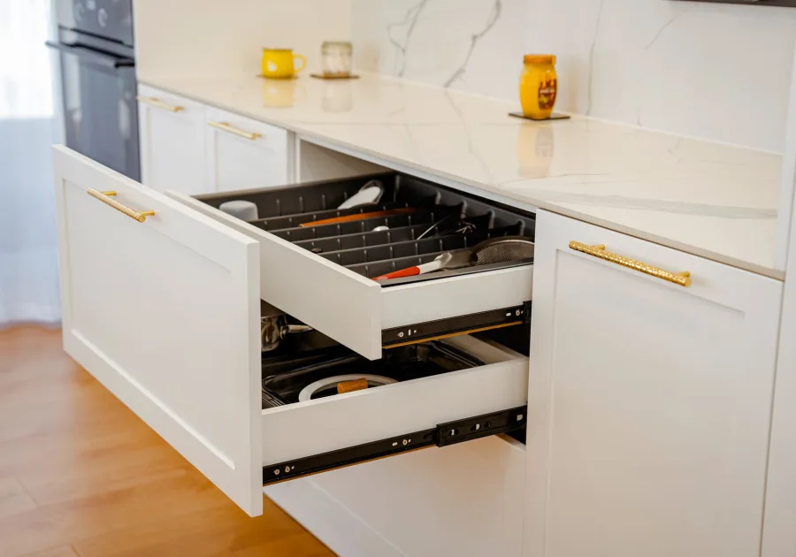 Run of fitted kitchen cabinetry with an integrated drawer front