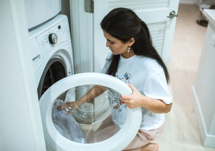 Front load washing machine in a tidy home laundry room - Asko washer repair