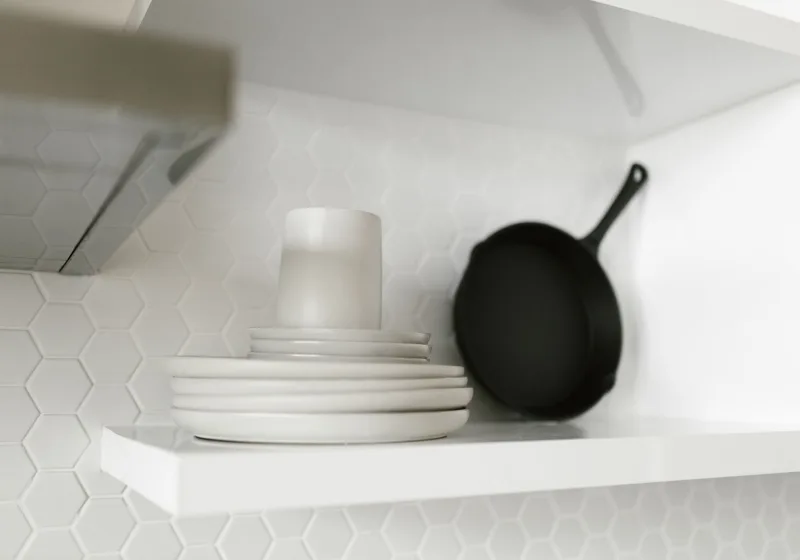 Open dishwasher loaded with clean dishes